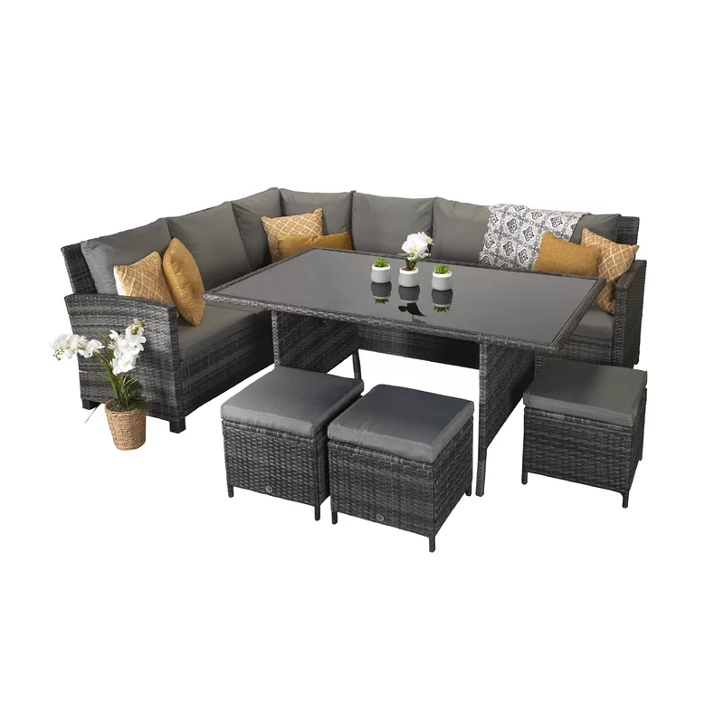 Outdoor wicker sectional sofa set arranged in an L-shape configuration.