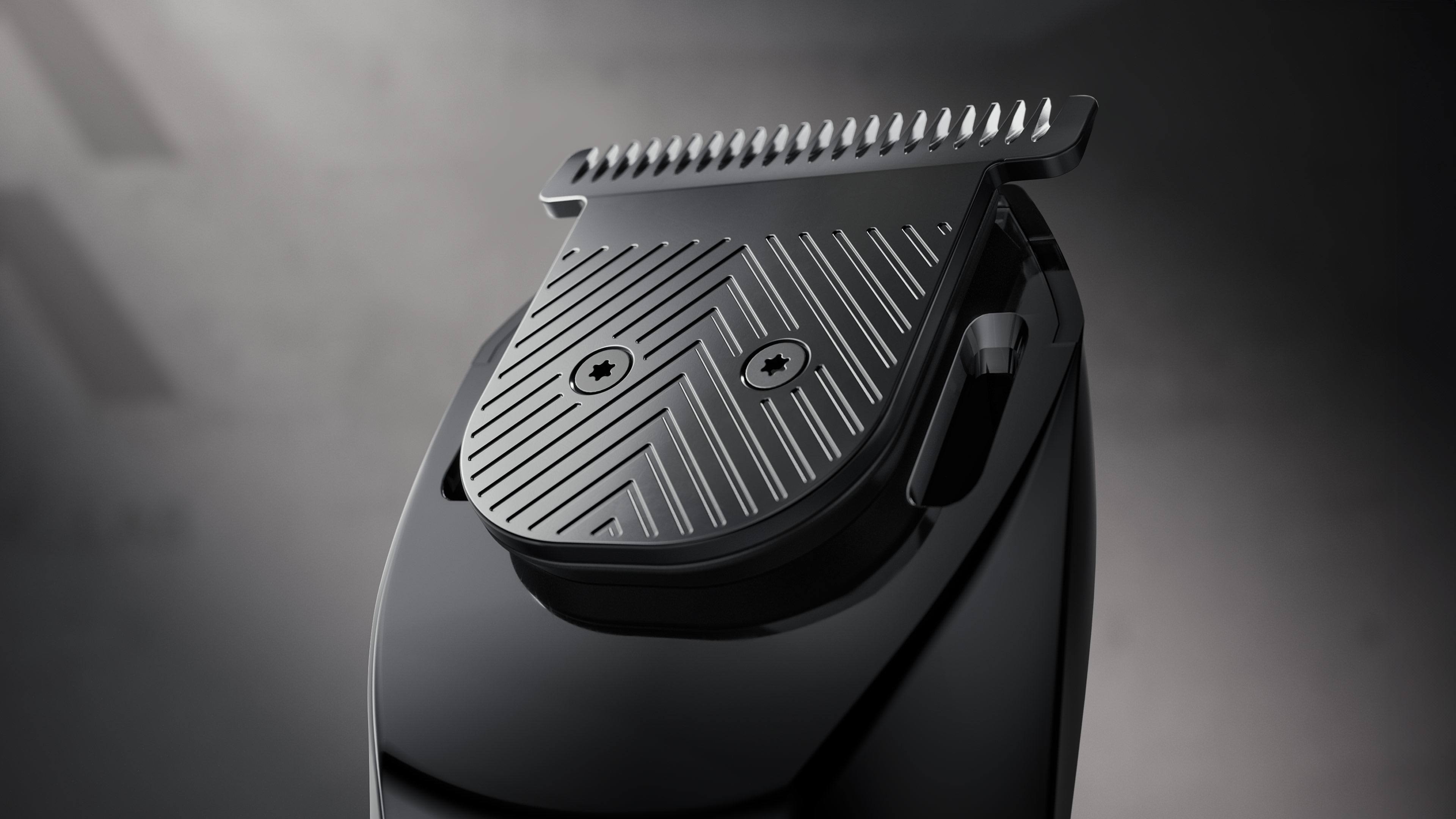 Close-up of the Beard Hedger trimmer head, highlighting its t-blade with a textured black finish.