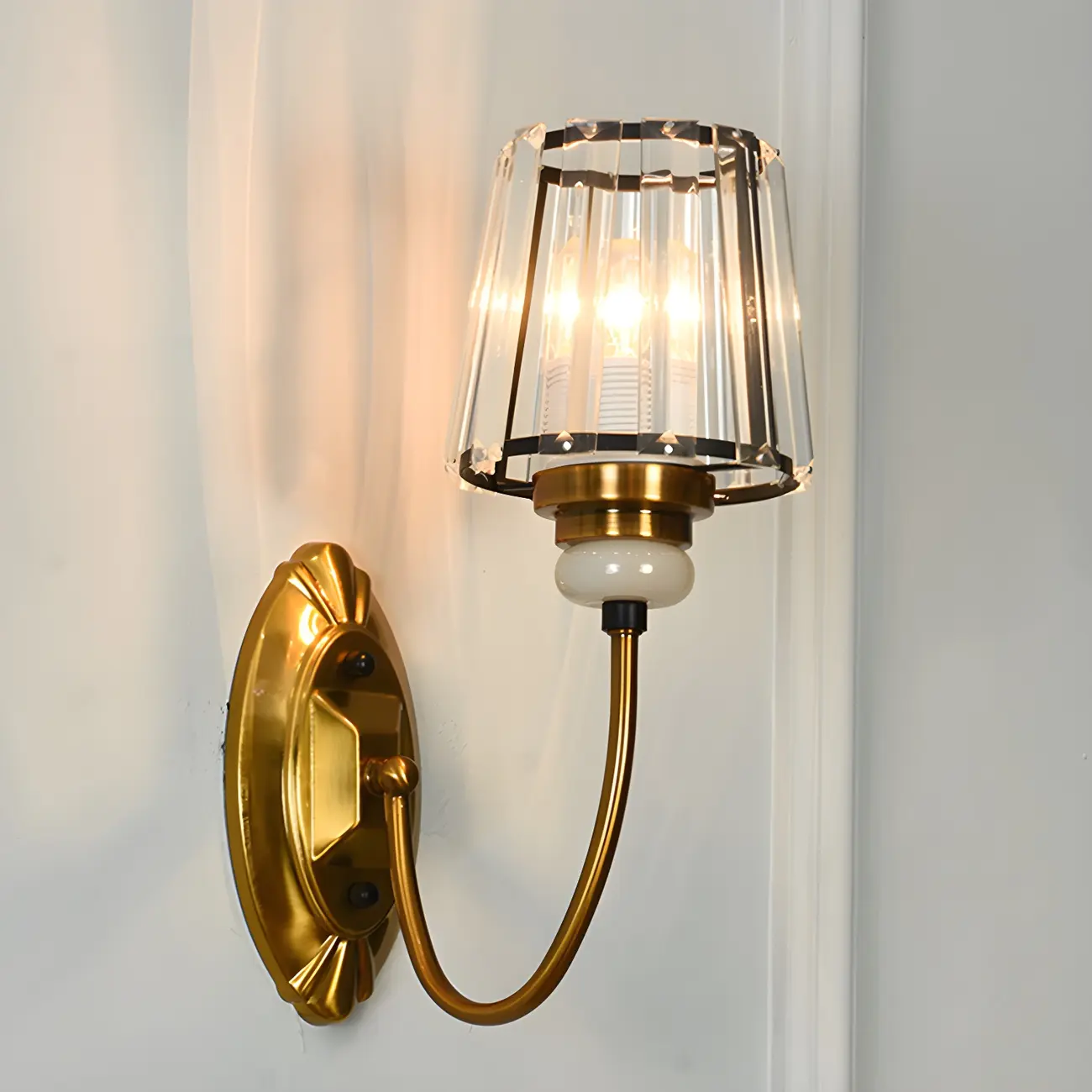 Elegant Brass Wall Sconce with Crystal Shade