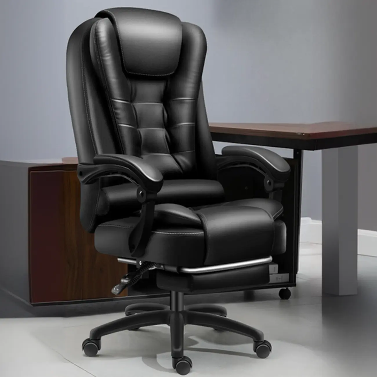 Ergonomic Black Leather Swivel Office Chair with Footrest